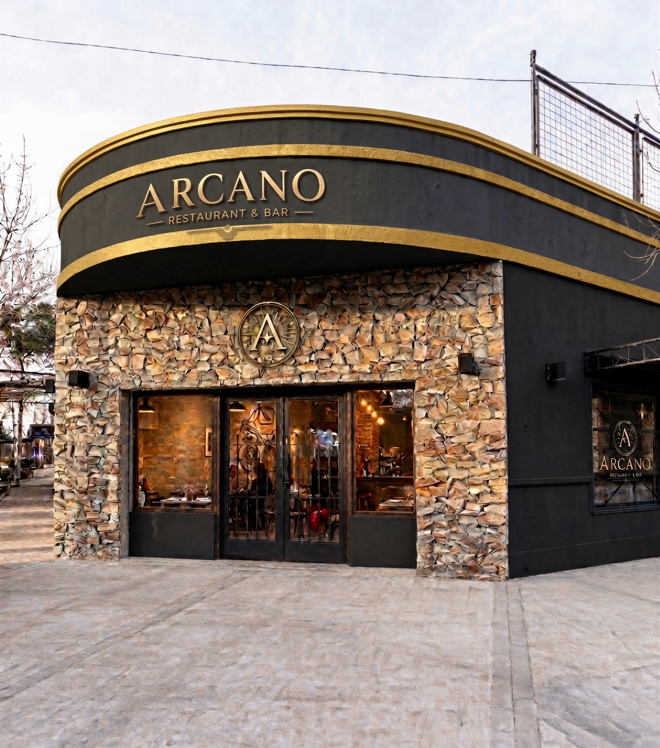 Frente de Arcano Restaurant & Bar, fachada negra con oro y piedra